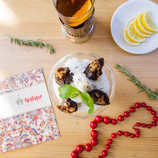 Prunes stuffed with walnuts served with whipped sweet cream