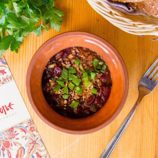Red beans stewed in a pot with walnuts and cilantro e1634906387208