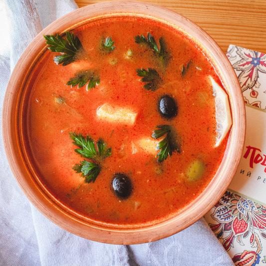 Sturgeon soup with salted cucumbers and olives e1714585916142